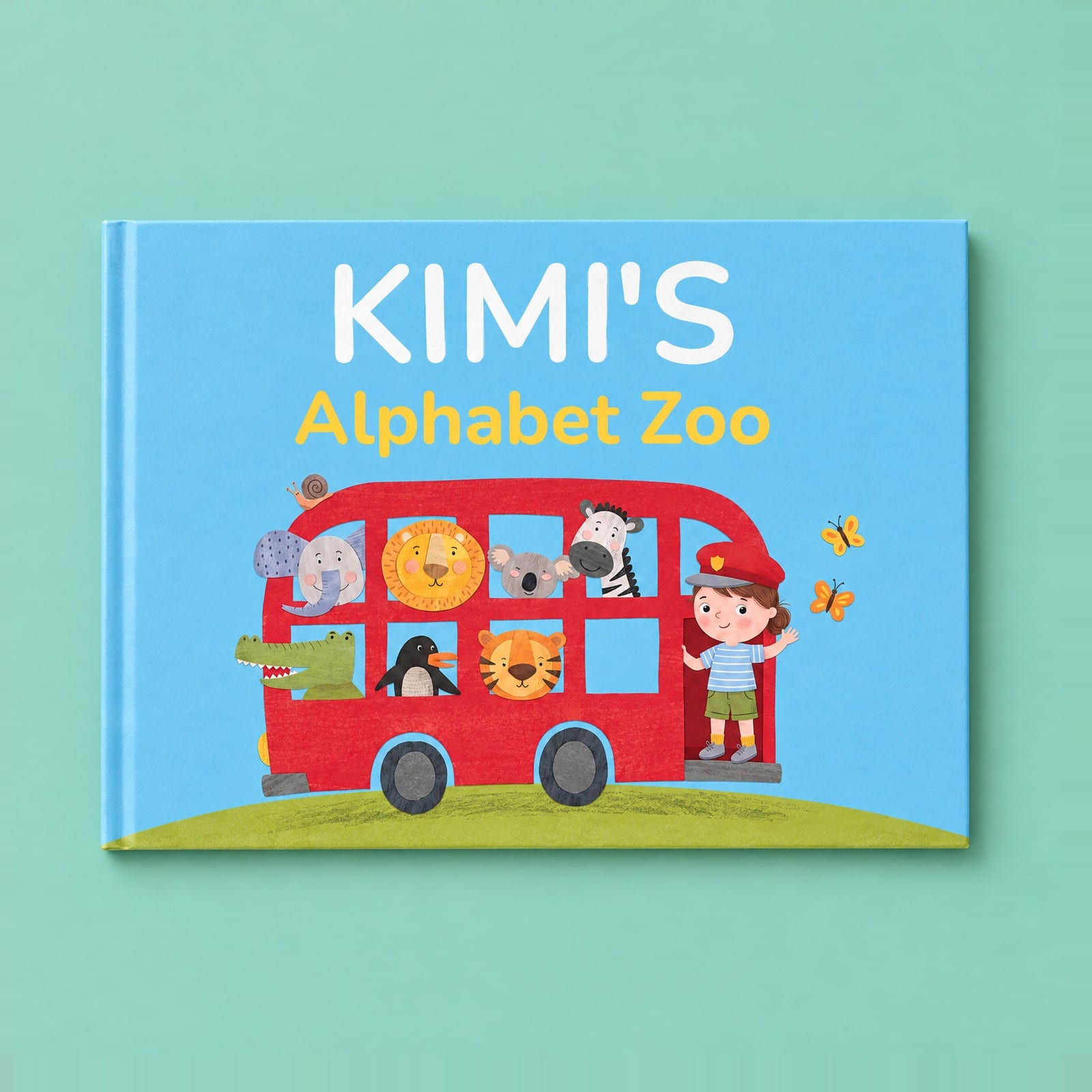 Kimi's Alphabet Zoo, a landscape picture book with the example child waving from a red zoo bus full of animals.